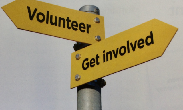 Signpost with Volunteer wording